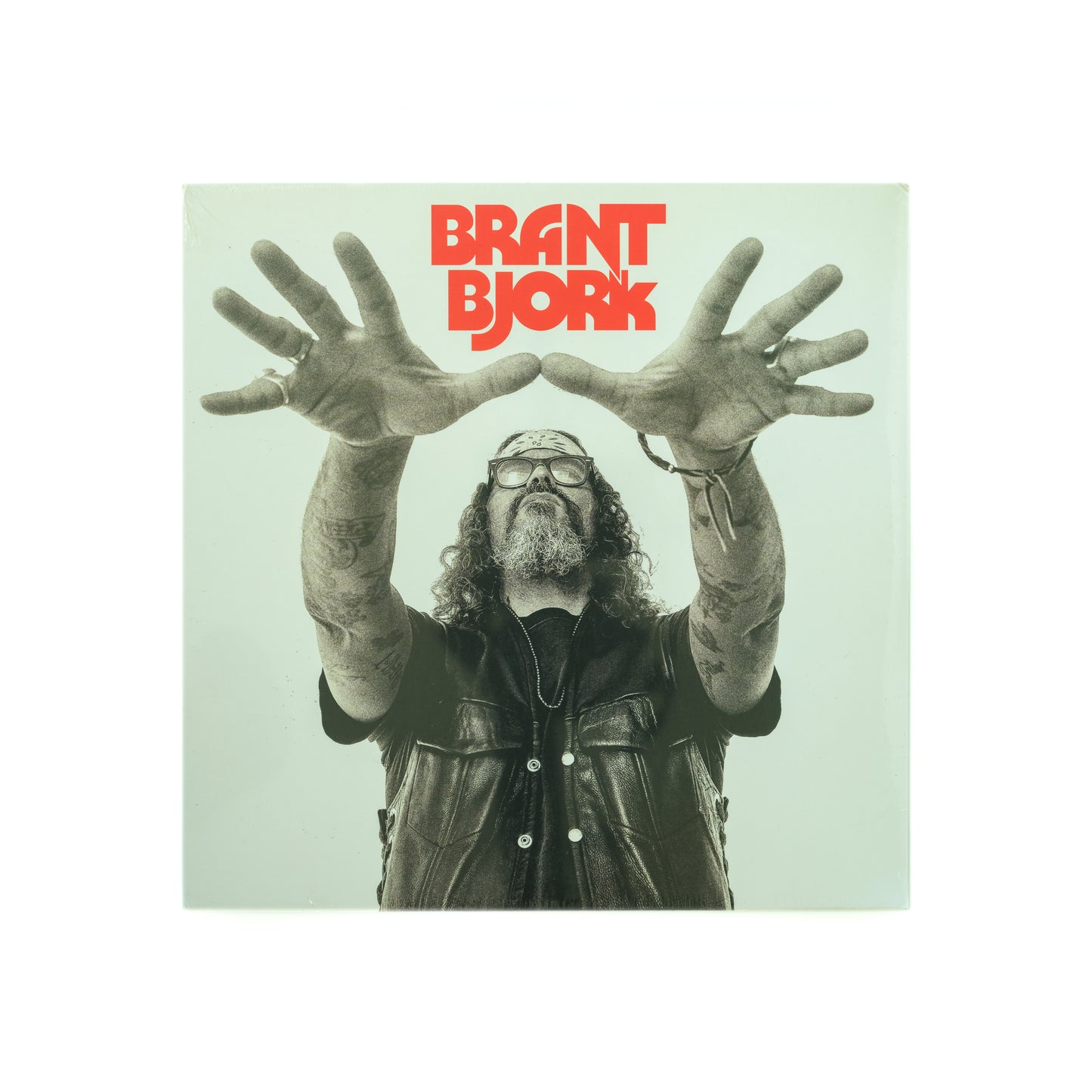 Front cover of Brant Bjork – Self-Titled vinyl LP, featuring minimalist photography of Brant Bjork with outstretched hands like a wizard.