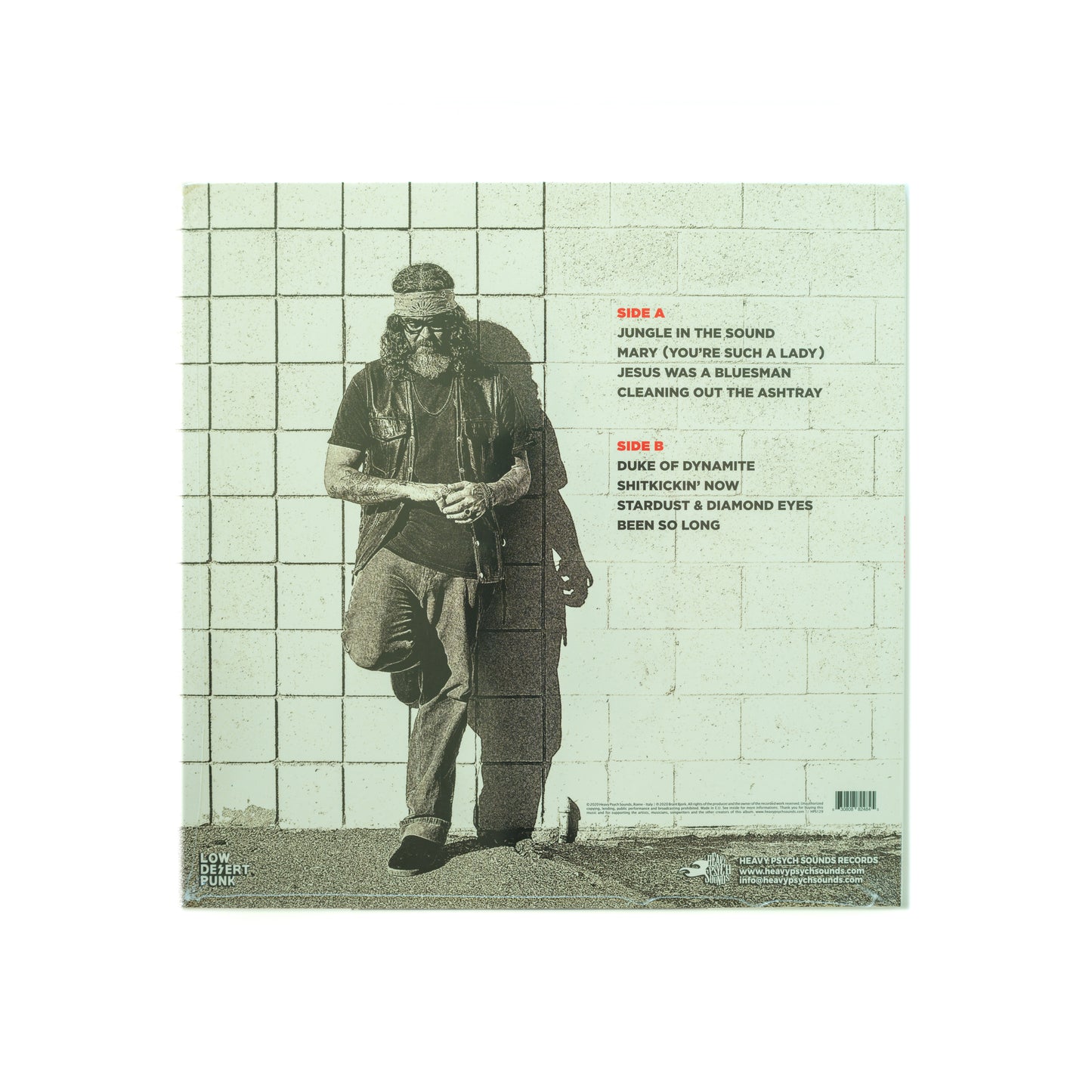Back cover of Brant Bjork – Self-Titled LP, with tracklist over a muted, earth-toned background, featuring credits and relaxed visuals that mirror the album’s soulful, funky desert rock vibe and stripped-down production.