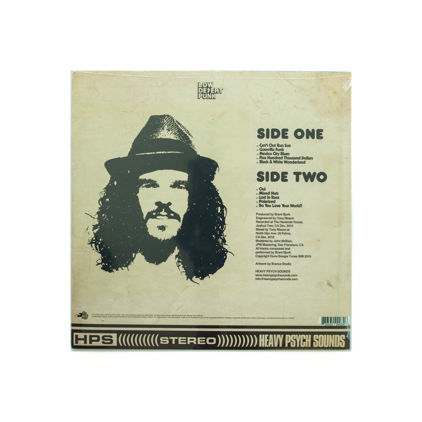 Back cover of Brant Bjork – Jacoozzi LP, showing the tracklist and production credits over a warm-toned backgrouns, with retro fonts and visual textures that reflect the album’s improvisational groove, jazzy flow, and underground Palm Desert roots.