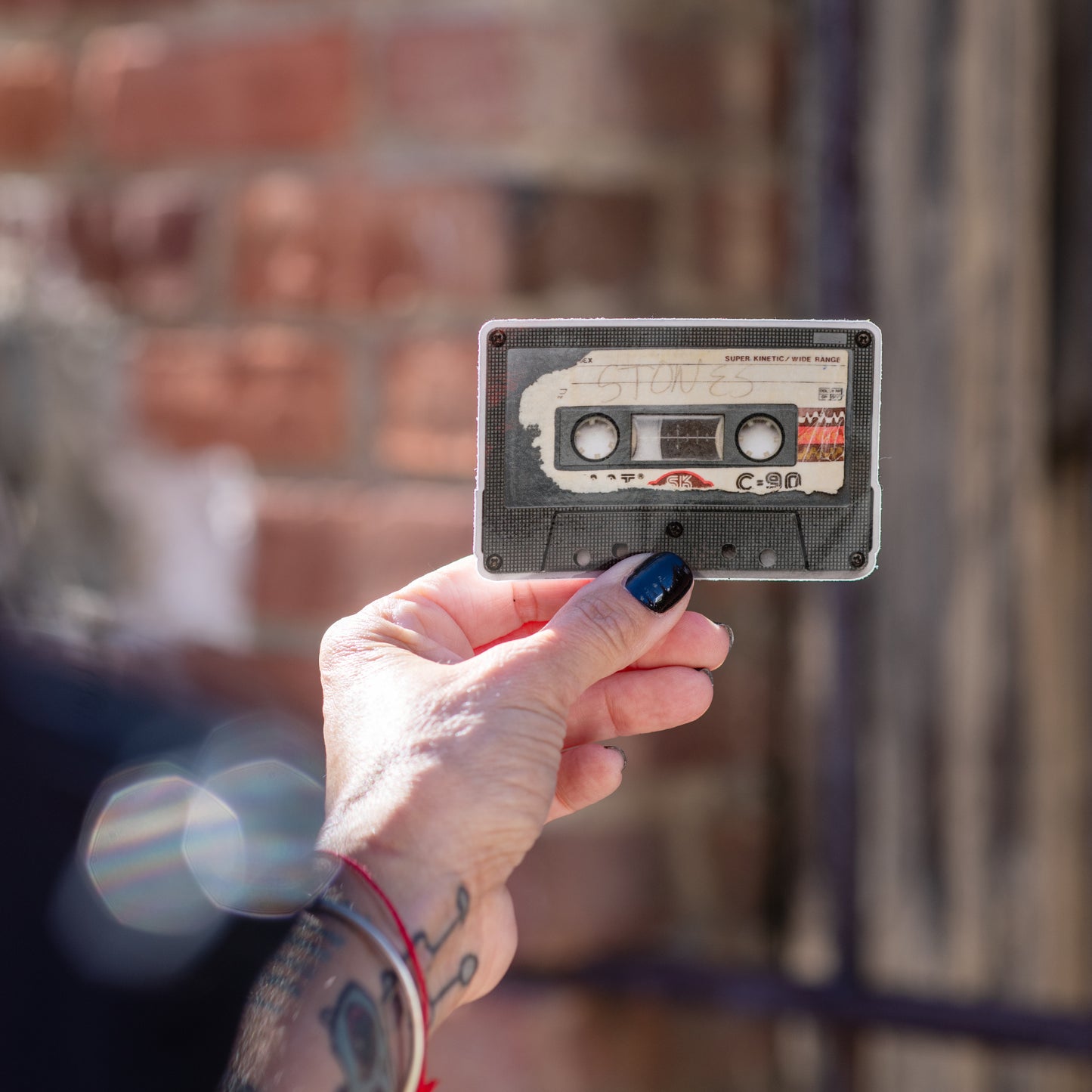 Glossy vinyl sticker (3.6" x 2.2") designed from a photo of a 1985 Rolling Stones cassette mix tape — water-resistant and UV coated.