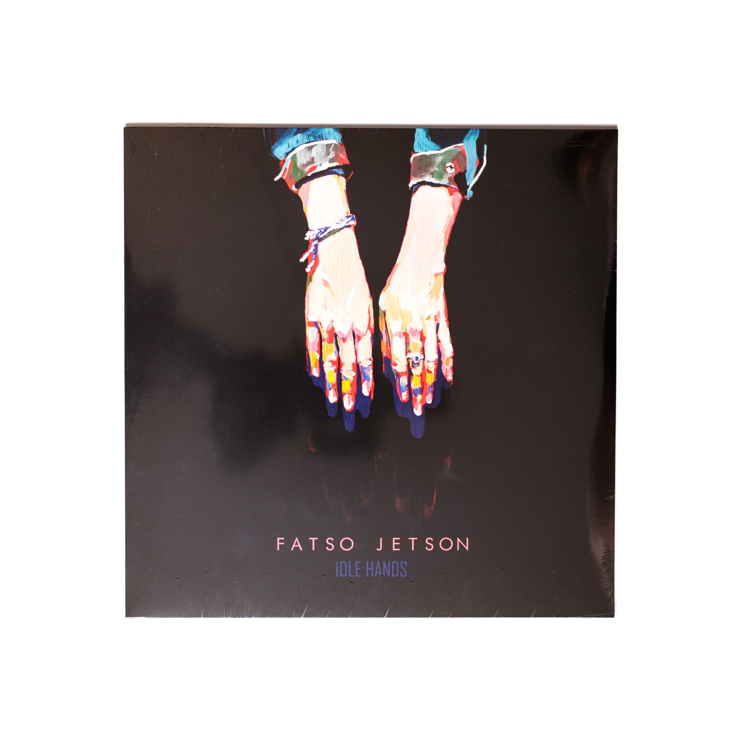 Fatso Jetson Idle Hands LP front cover with stylized illustration of a hand gripping a knife, bold text and gritty textures.
