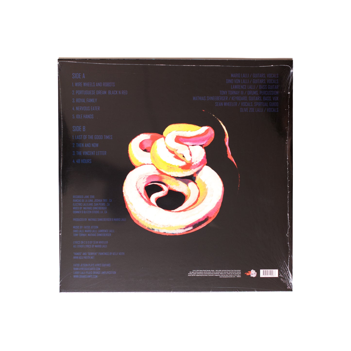 Back cover of Fatso Jetson Idle Hands LP showing tracklist, band credits, and abstract artwork with muted desert tones.