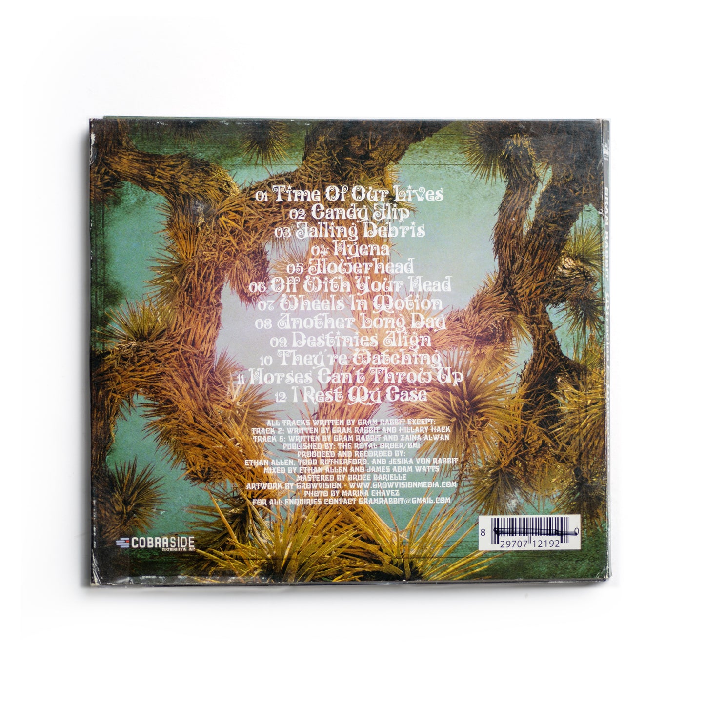 Back cover of Gram Rabbit Miracles and Metaphors CD showing full tracklist including 'Time of Our Lives,' 'Candy Flip,' 'Falling Debris,' 'Hyena,' and 'Flowerhead,' 2006 release blending electronic, indie rock, and psychedelic elements.