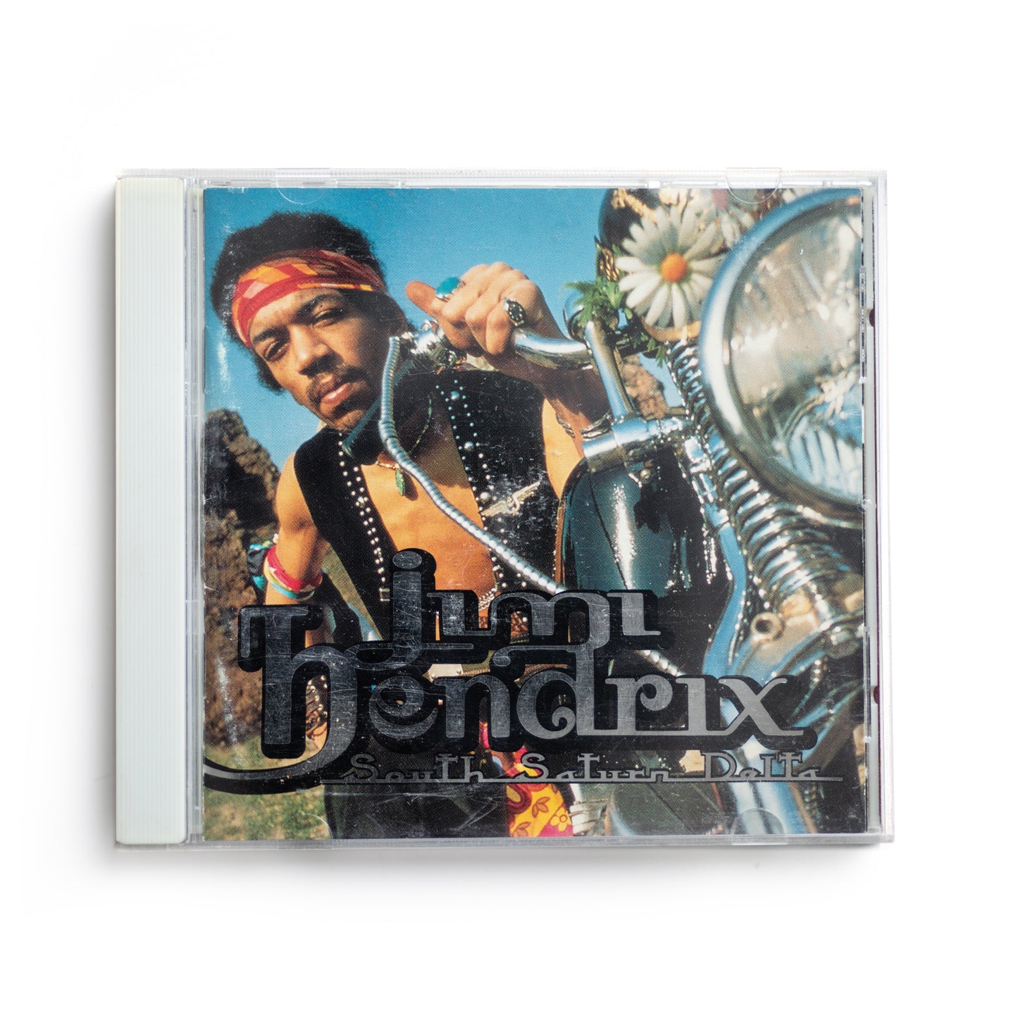 Front cover of Jimi Hendrix South Saturn Delta CD featuring bold, colorful artwork, posthumous 1997 compilation album, includes unreleased tracks and rare recordings from the legendary guitarist.