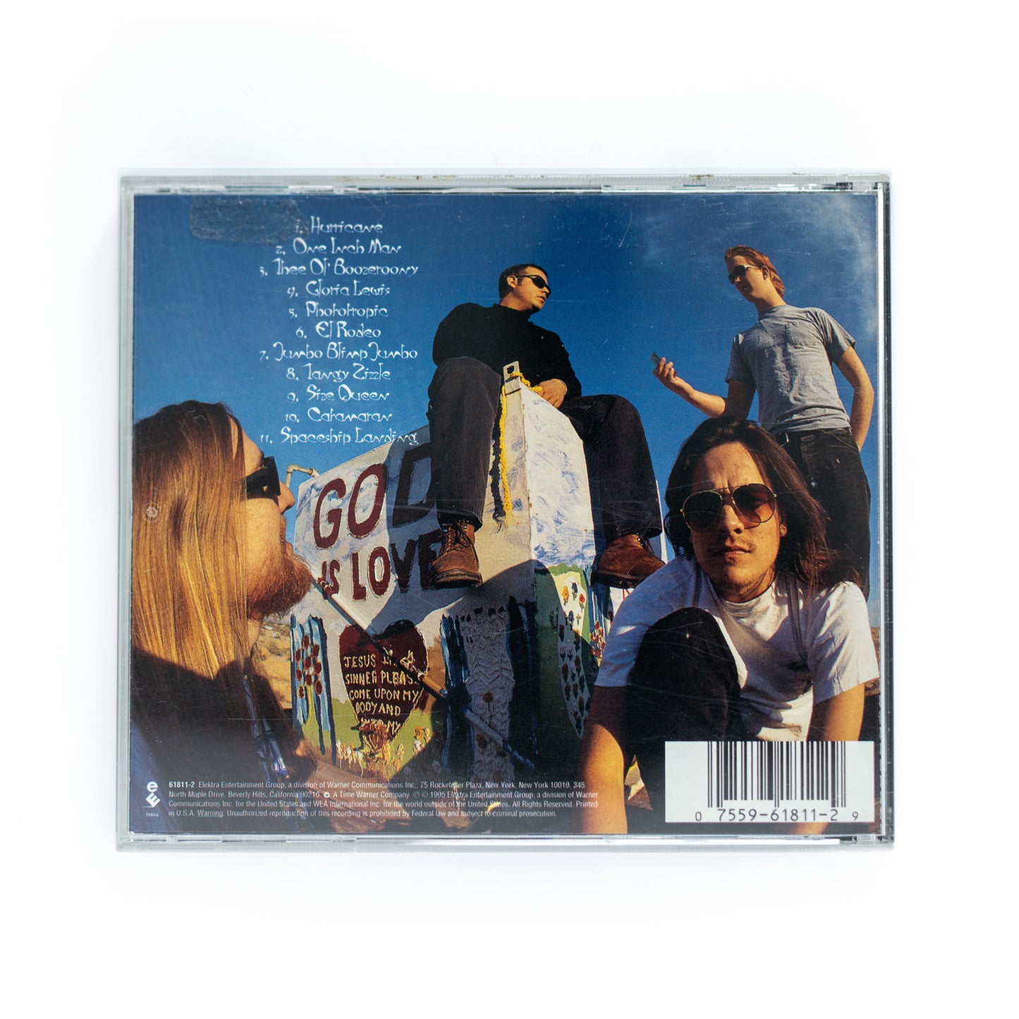 Back cover of Kyuss Circus Leaves Town CD showing full tracklist including 'One Inch Man,' 'Thee Ol' Boozeroony,' and 'Space Cadet,' 1995 release, influential desert rock and stoner album.