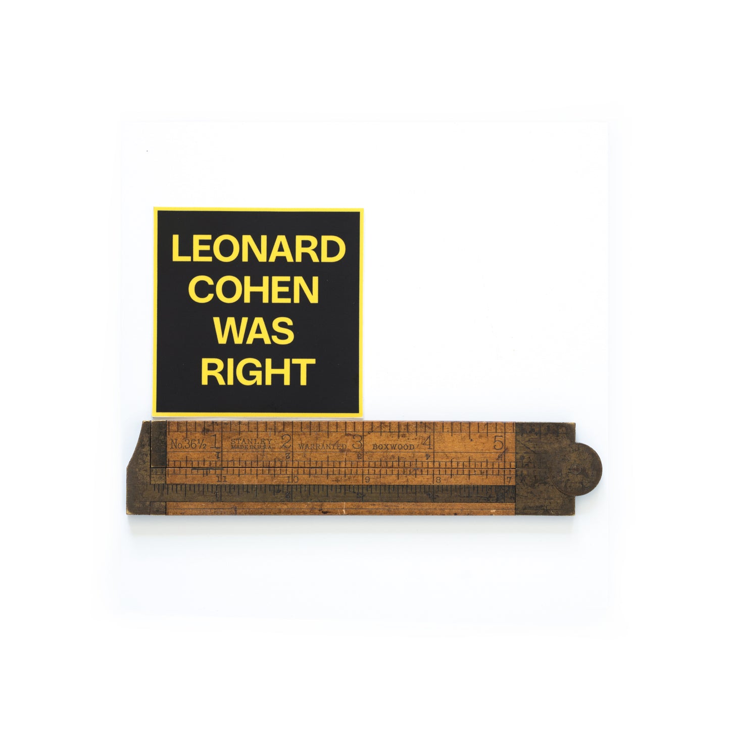 Leonard Cohen was right sticker photographed with a ruler to show scale — 3 inch by 3 inch square.