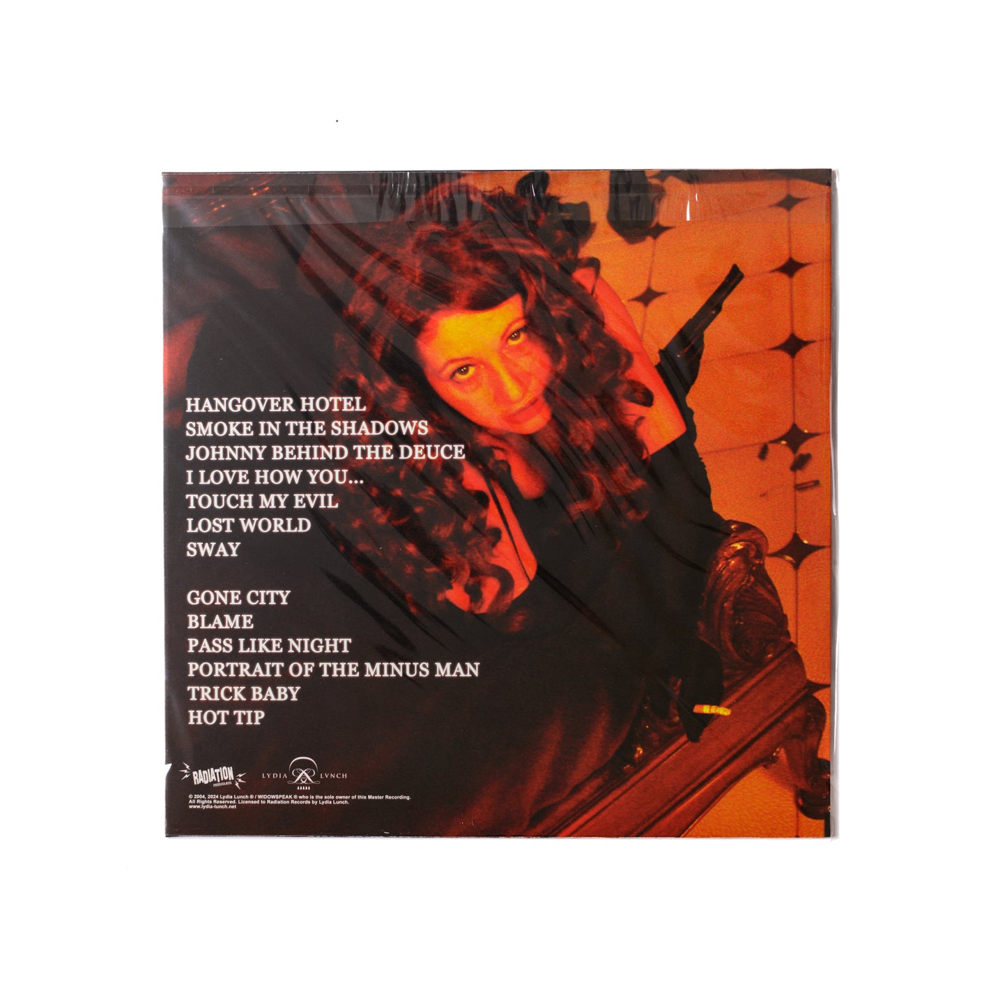 Back cover of Smoke In The Shadows LP showing tracklist, album credits, and shadowy visual motifs with minimalist design.
