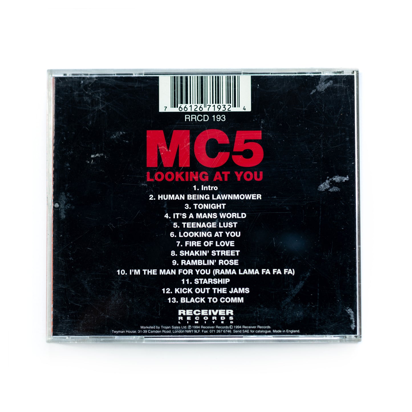 Back cover of MC5 Looking at You CD showing full live tracklist including 'Looking at You,' 'Ramblin' Rose,' and 'Kick Out the Jams,' 1970 live recordings, raw and revolutionary sound from MC5, garage rock legends.