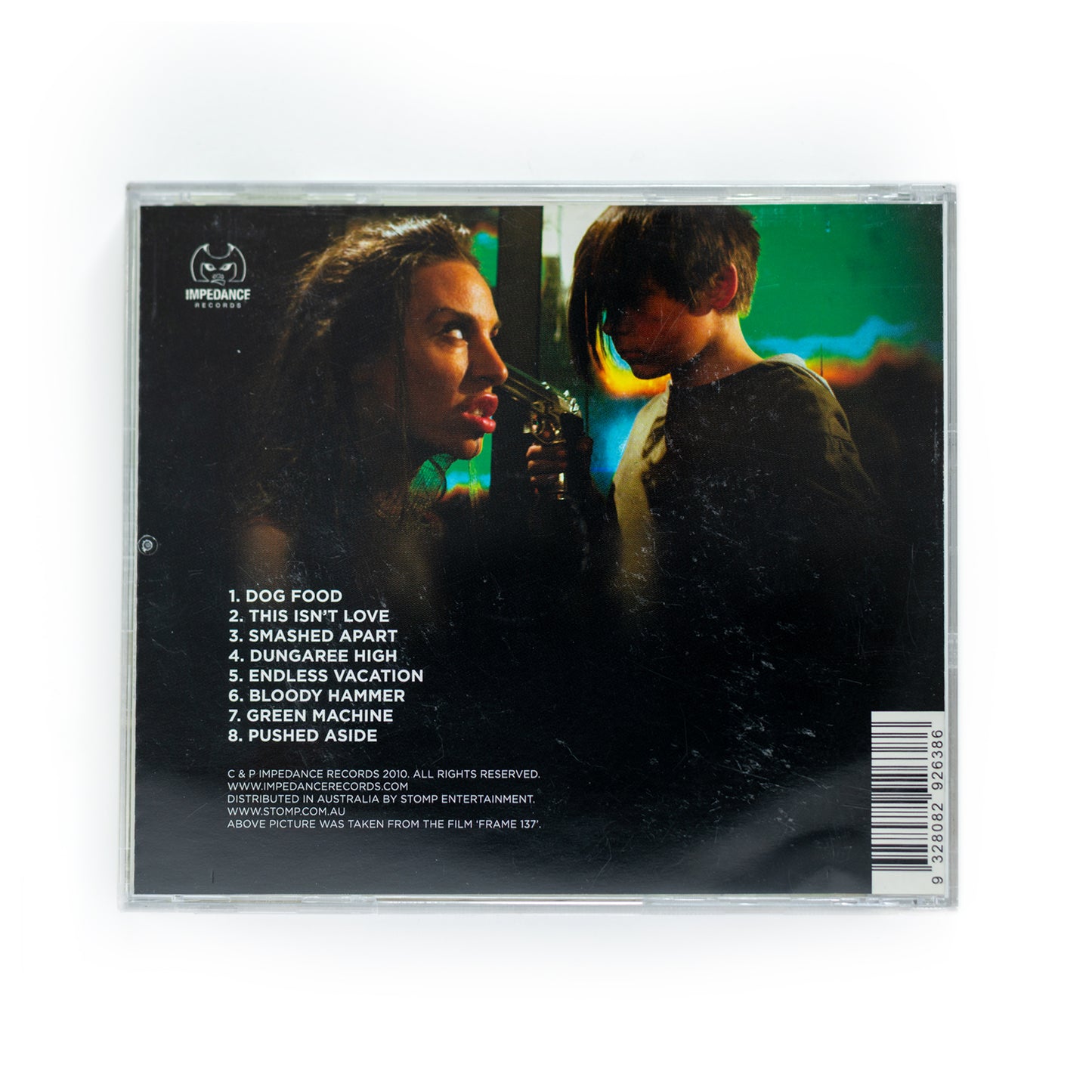 Back cover of Mondo Generator Dog Food CD showing full tracklist including 'Dog Food,' 'This Isn't Love,' 'Green Machine,' and 'Pushed Aside,' 2003 release, gritty punk and heavy metal crossover, Nick Oliveri's desert rock project.