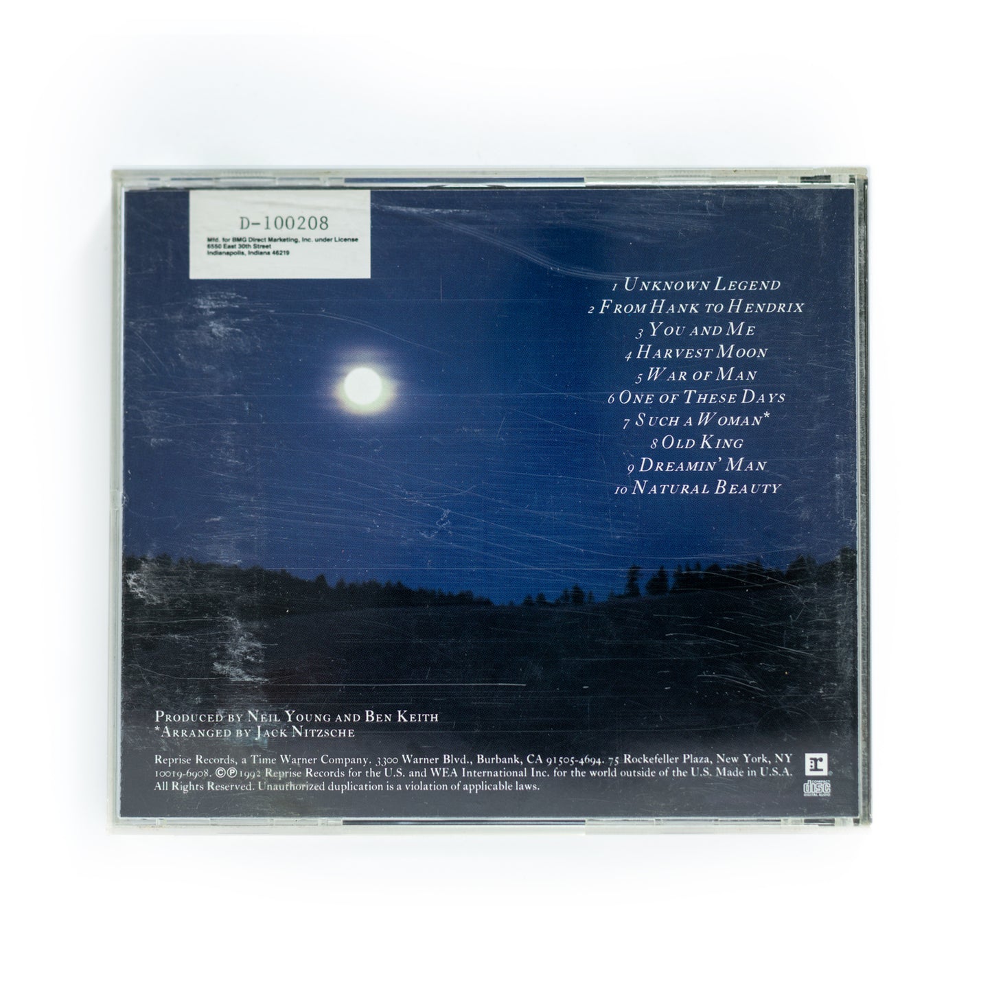 Back cover of Neil Young's Harvest Moon CD with the tracklist, including songs like 'Harvest Moon,' 'You and Me,' and 'From Hank to Hendrix.' The design includes a simple layout with song titles, credits, and production information.