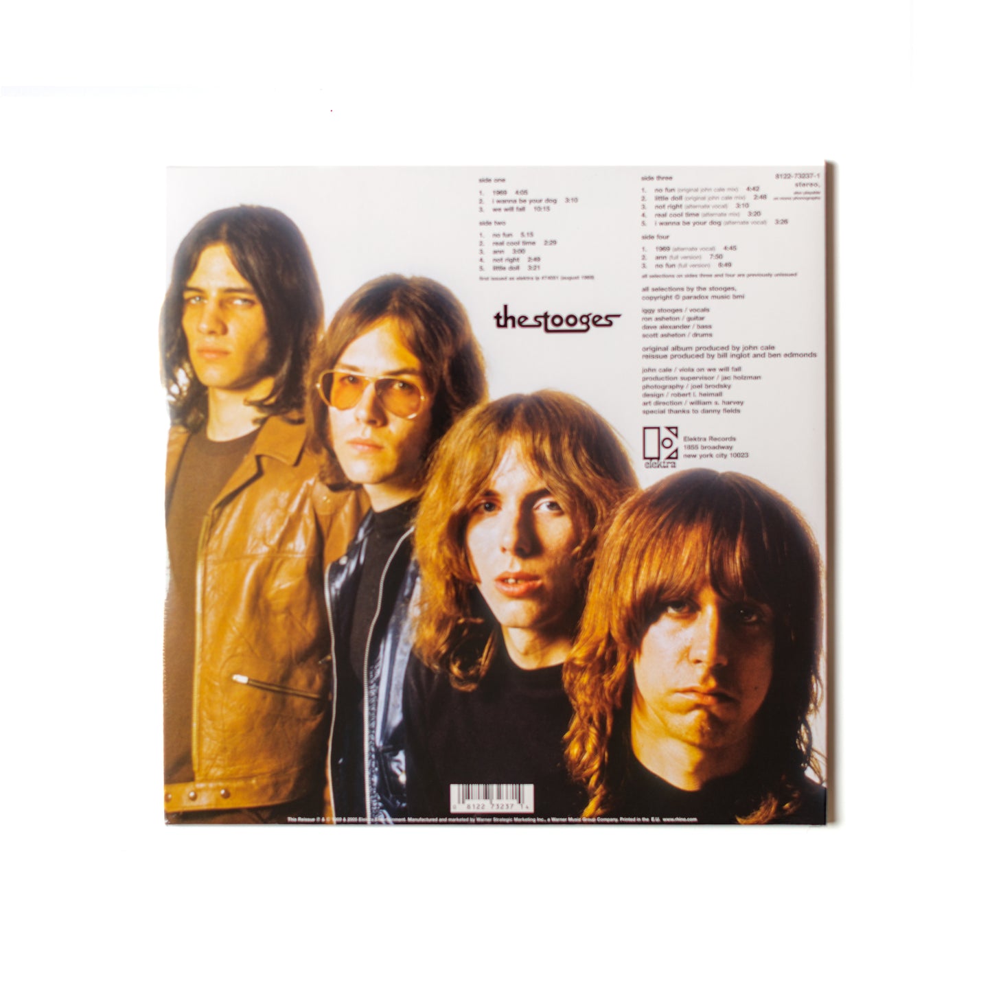 Back cover of The Stooges 2xLP remastered reissue featuring tracklist, album credits, and reissue details in a vintage-style design.