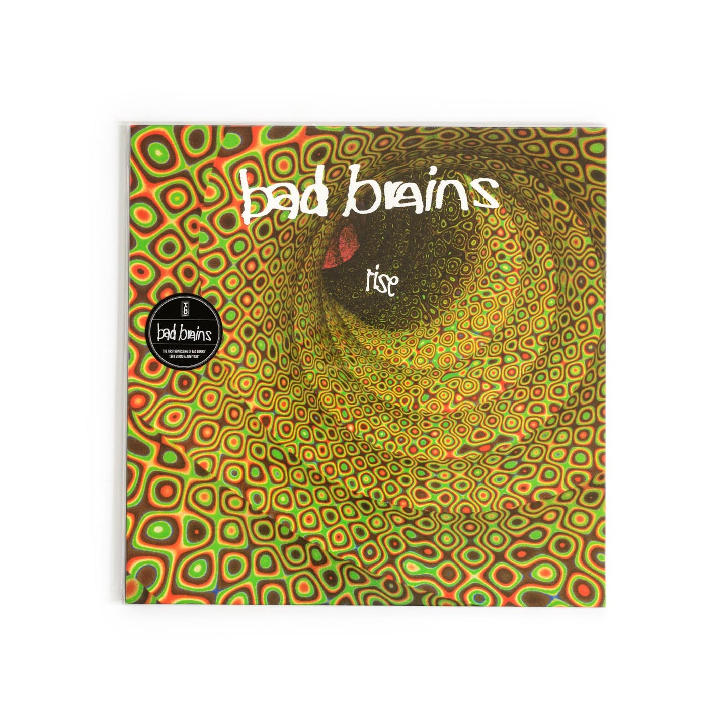 Album cover of Rise by Bad Brains, featuring an abstract design with futuristic type and glowing light beams. A bold visual departure from their early punk roots, reflecting the album’s polished crossover style.