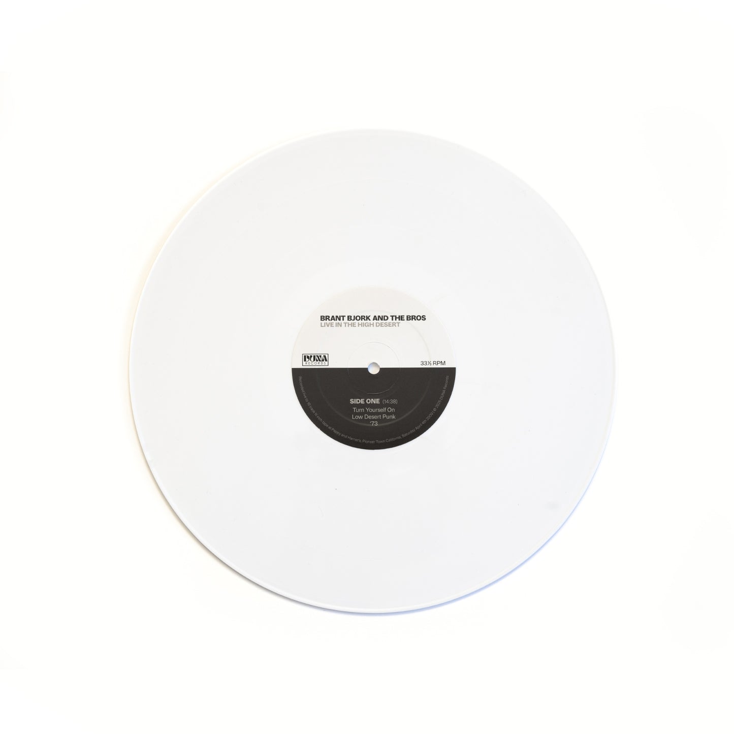 White vinyl record of Brant Bjork and the Bros Live in the High Desert with on a white background.