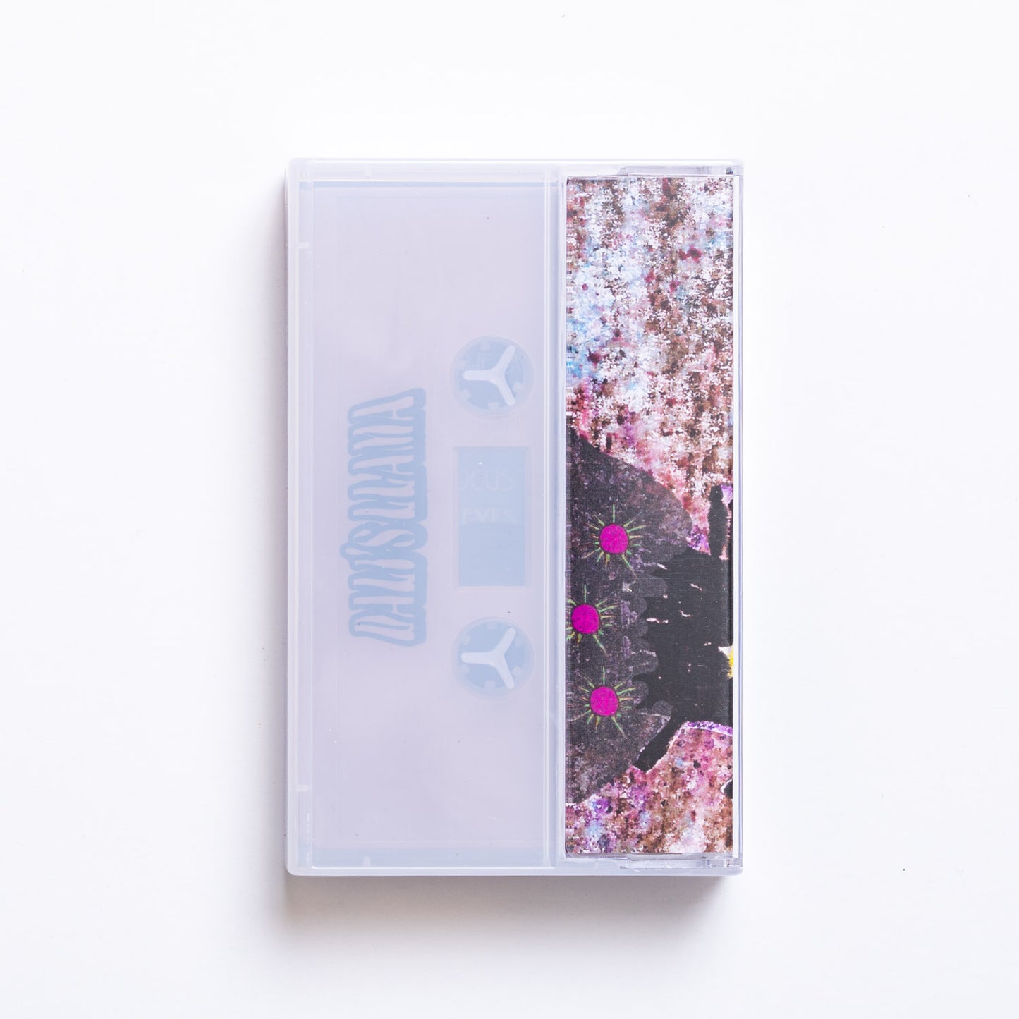Back cover of Dali's Llama Dying In The Sun cassette tape with floral design on a white background
