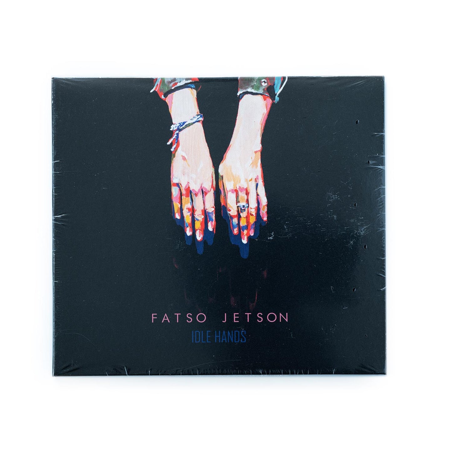 Fatso Jetson – Idle Hands CD front cover with surreal artwork, featuring skeletal hands, and vibrant psychedelic colors; bold album title and band name evoke the band’s signature desert rock and experimental punk sound.