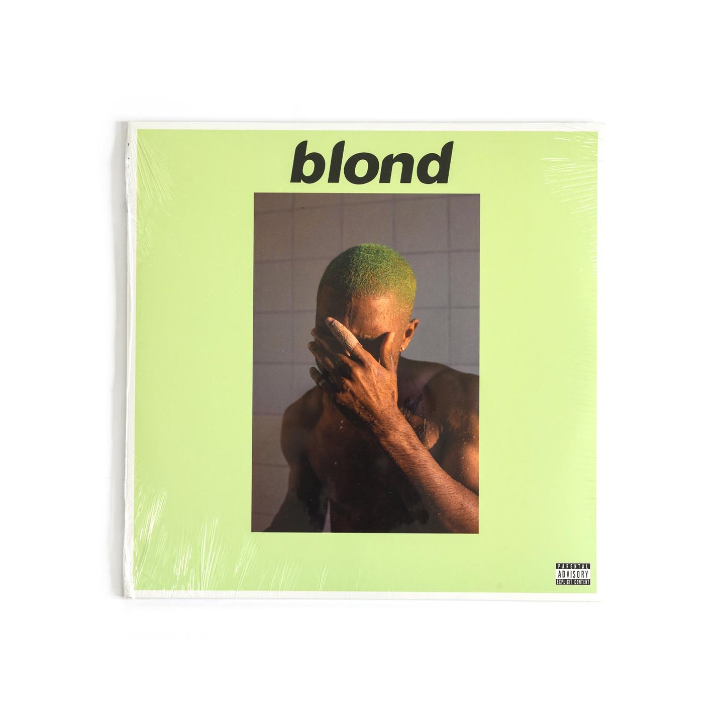 Minimalist cover image of Frank Ocean’s Blond album, featuring the artist with bleach-blonde hair and a hand over his face. Evocative photography in a stark shower scene, capturing the emotional depth of the album.