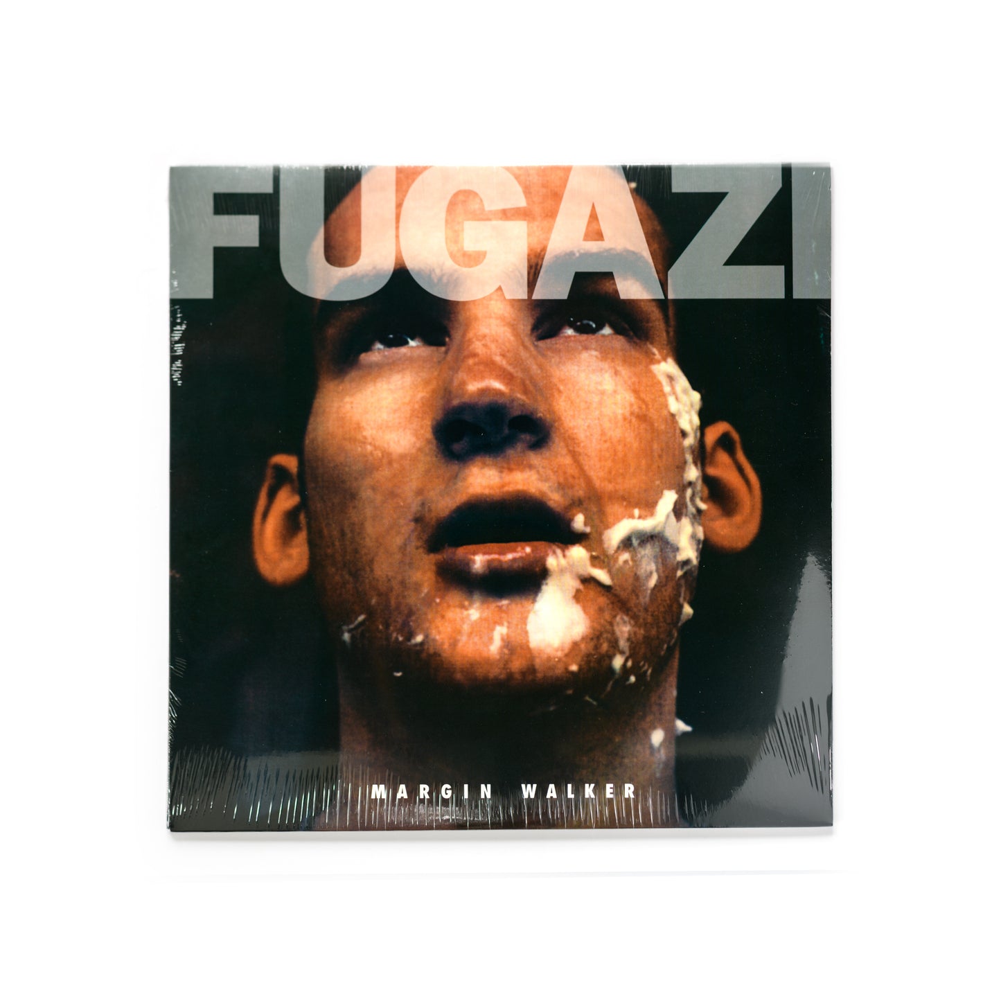 Fugazi – Margin Walker EP cover artwork, photo by Tomas Squip featuring stark portrait-style imagery with minimalist typography. Iconic visual aesthetic tied to the Washington D.C. post-hardcore scene. Remastered vinyl reissue from Dischord Records, 2009. Essential for punk, indie, and Fugazi fans.