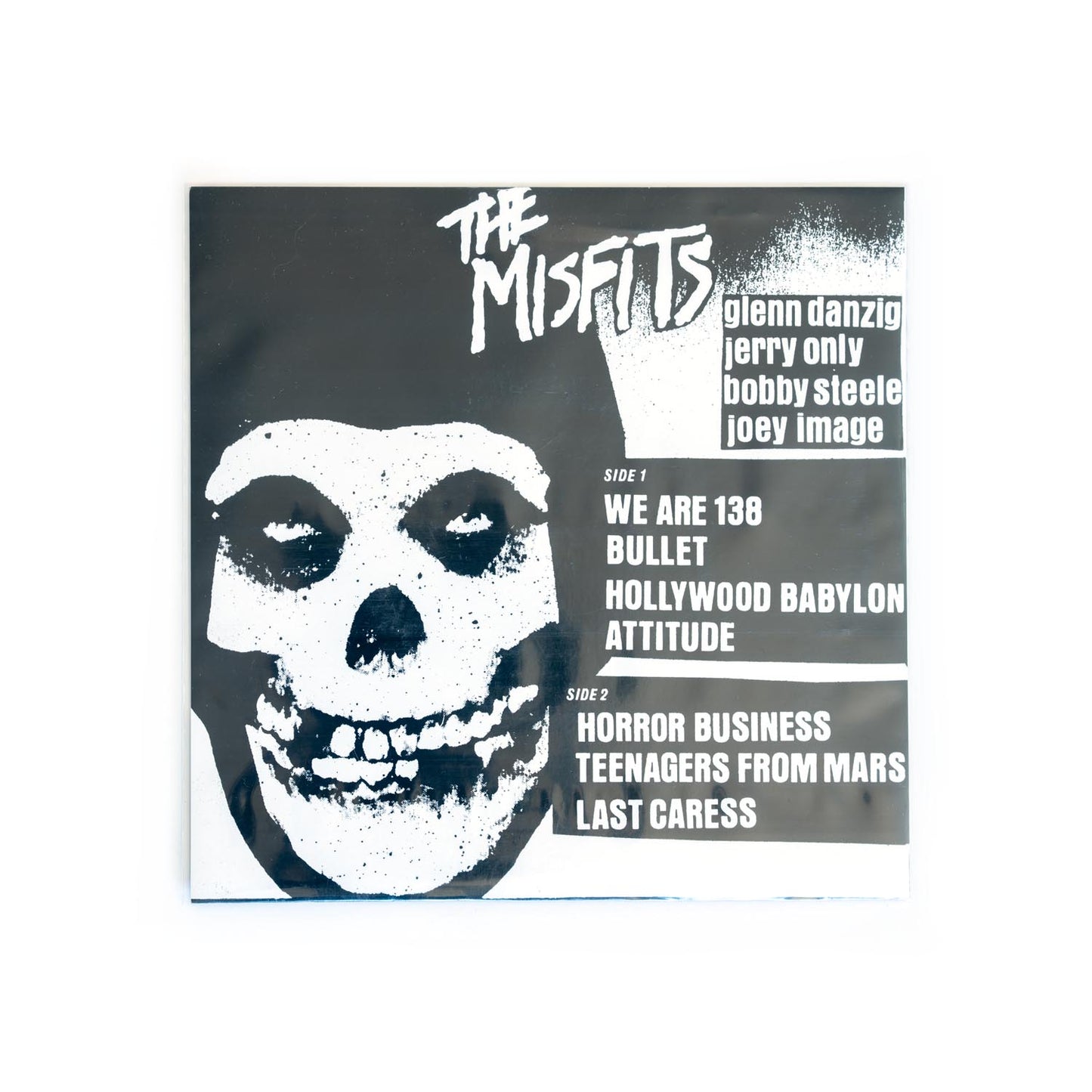 Back cover of Misfits beware with crimson skull design and text on a white background. Band names: Glenn Danzig, Jerry Only, Bobby Steele, and Joey Image.