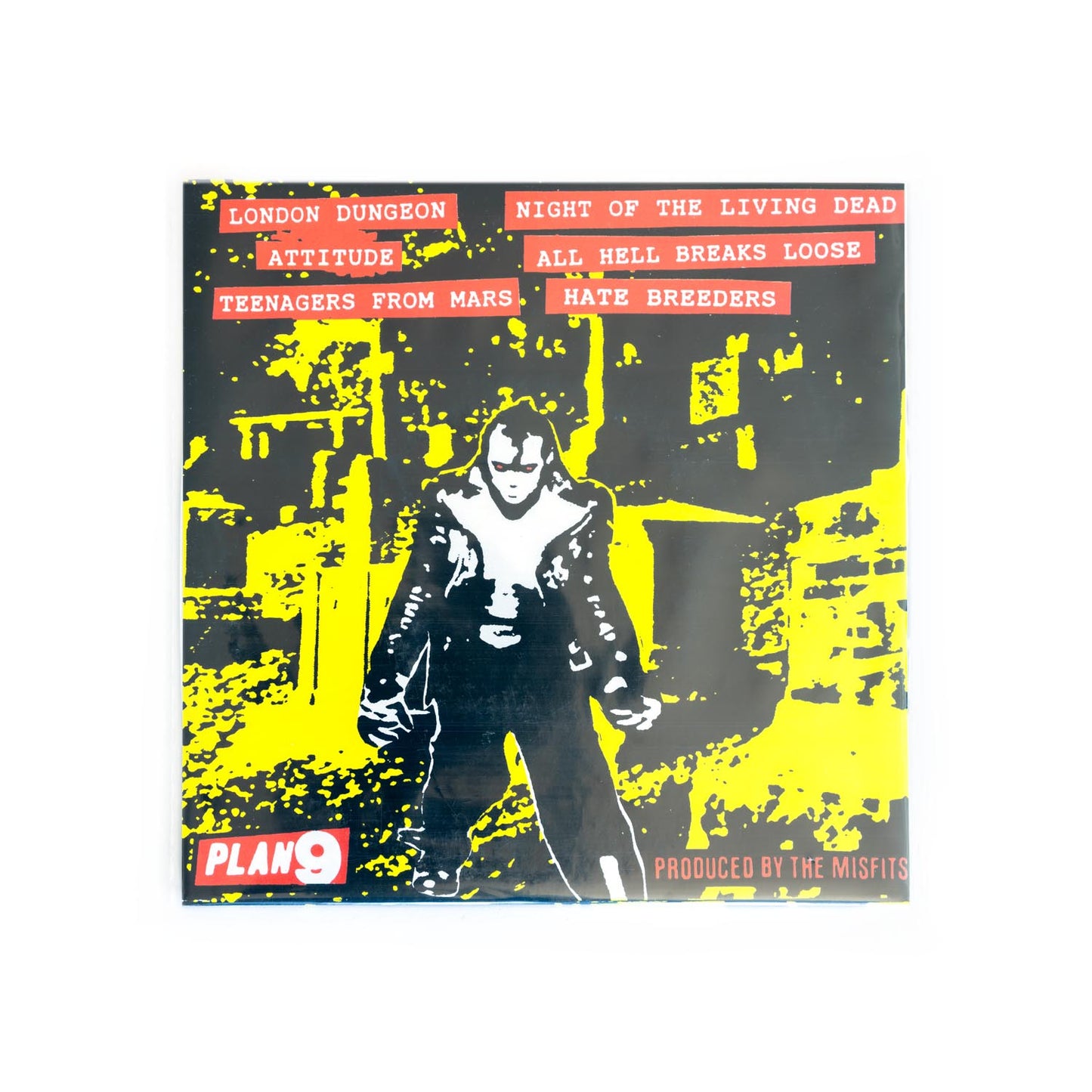 Vinyl record cover with a stylized illustration of Jerry Only against a yellow and black abstract background, featuring text and the Plan 9 logo.
