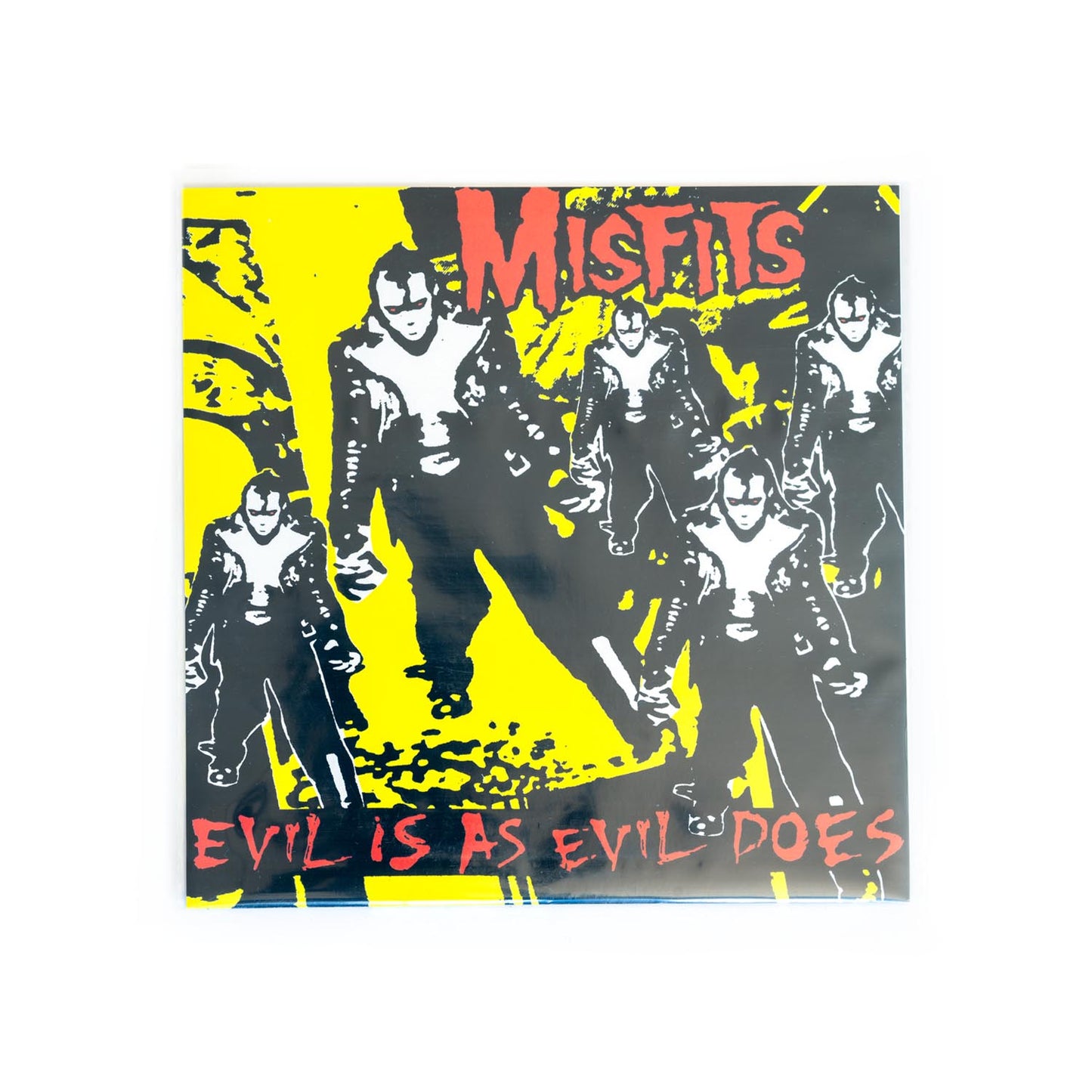 Album cover with band members and text 'Misfits Evil is as evil does' on a yellow and black background