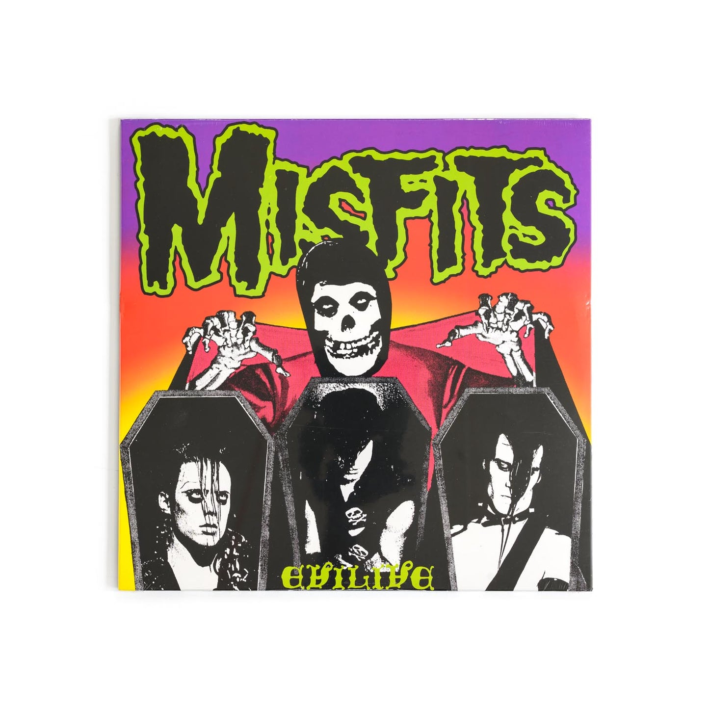 Misfits – Evilive album cover featuring black-and-white photos of the band in coffins, punk graphics with bold skeletal imagery and signature horror-punk aesthetics. An iconic live album from the Misfits.