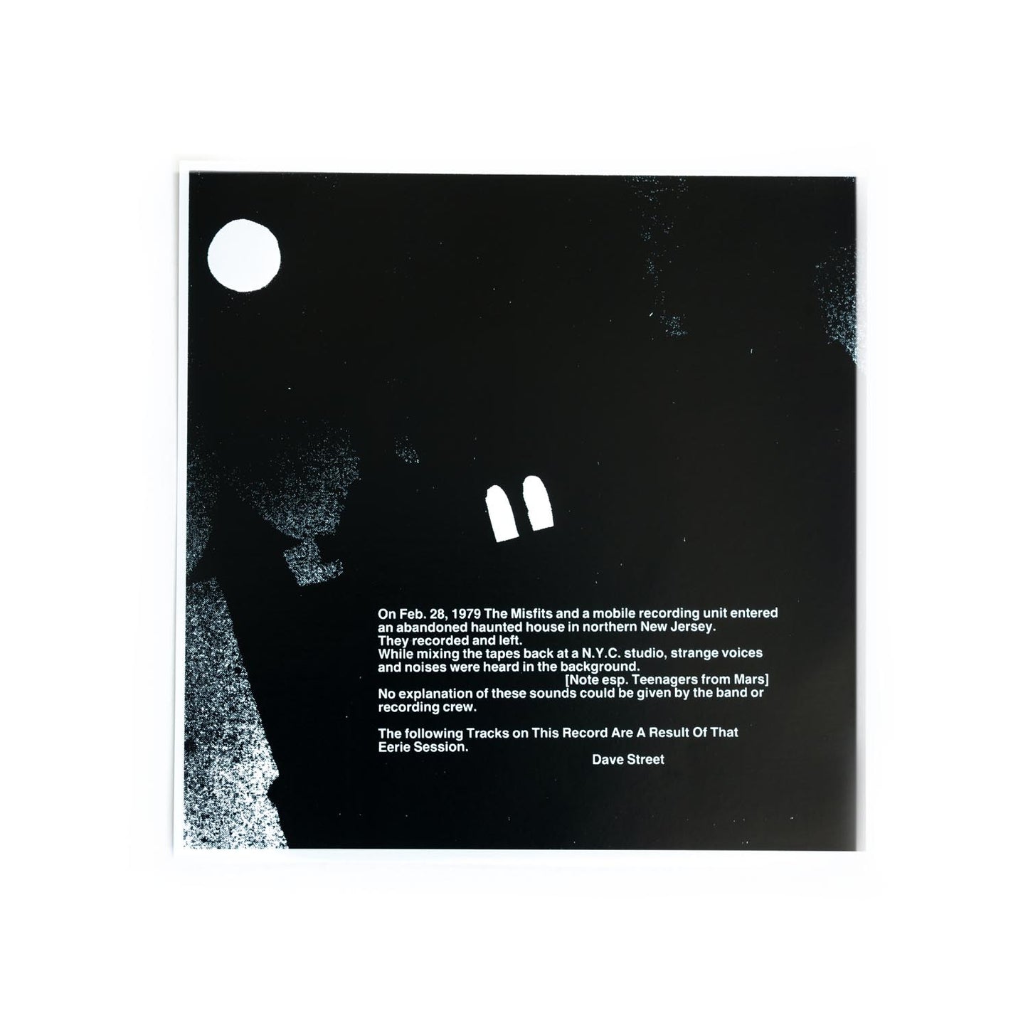 Black album cover with white text and abstract design elements and a haunted house story.