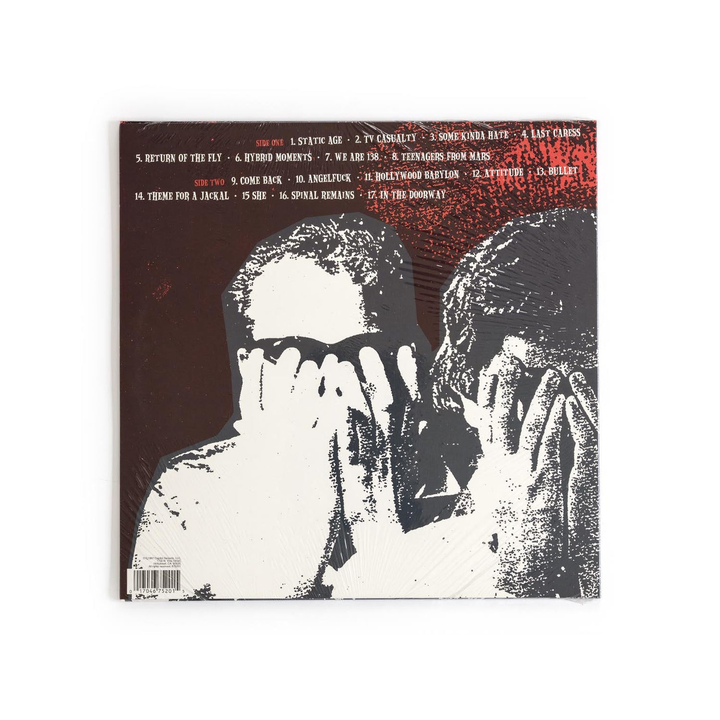 Back cover of Static Age vinyl showing complete tracklist, credits, Capitol Records barcode, and a black/red layout with minimalist punk design elements.