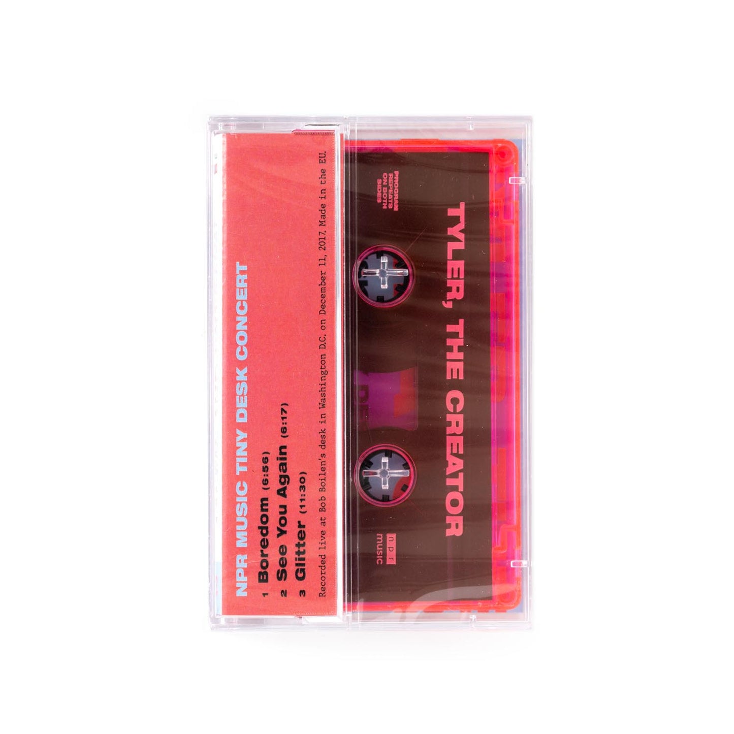 Cassette tape with red label featuring 'Tyler, The Creator' on a red background