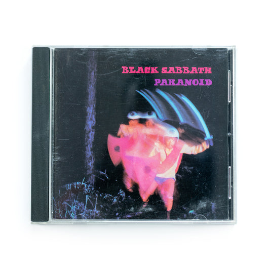 Front cover of Black Sabbath Paranoid CD featuring surreal image of figure with sword and shield in motion blur, classic 1970 heavy metal album, Warner Bros. / Vertigo Records release, includes hits 'War Pigs' and 'Iron Man,' iconic dark psychedelic artwork.