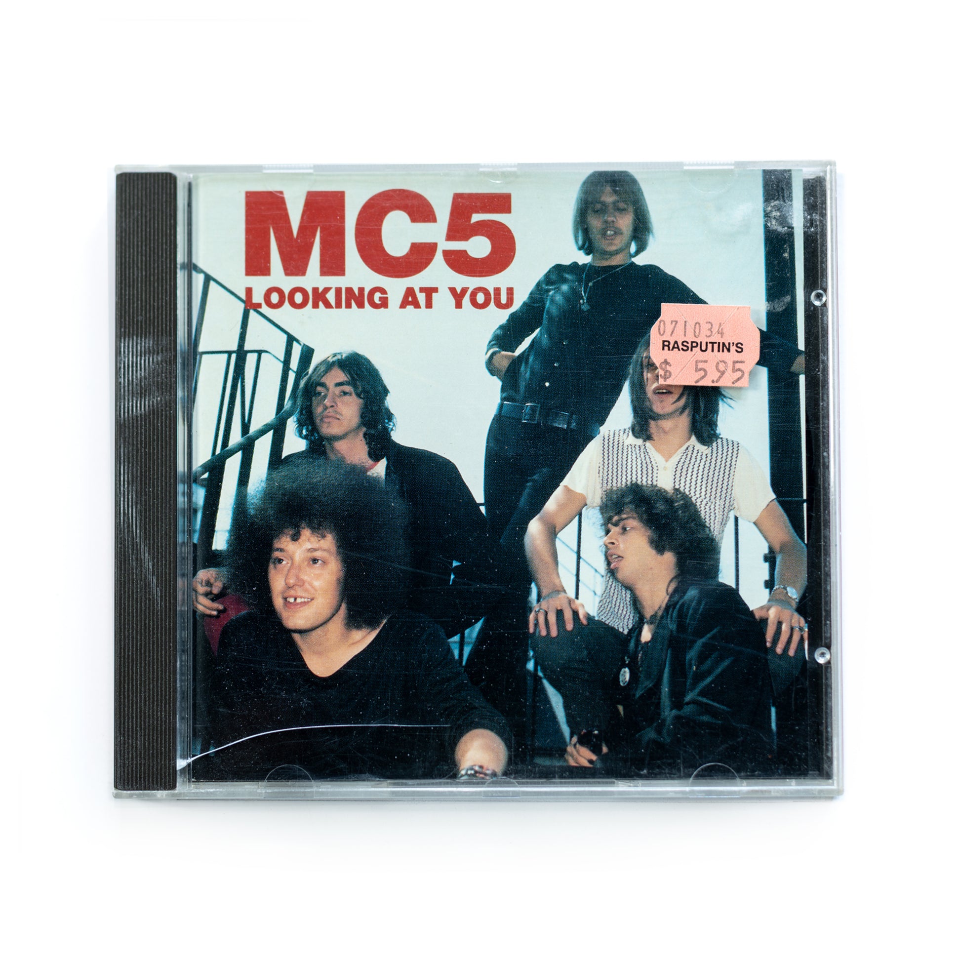 Front cover of MC5 Looking at You CD featuring a bold image of band members, live album from Detroit's iconic proto-punk band, includes tracks like 'Looking at You' and 'Kick Out the Jams,' 1970s garage rock.