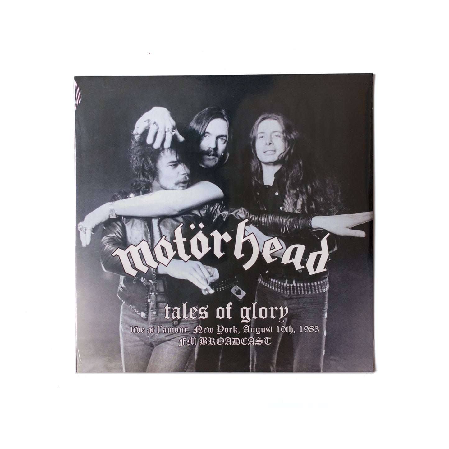 Motörhead Tales Of Glory LP front cover with gritty black-and-white photo of Lemmy and bold gothic text over a high-contrast image.