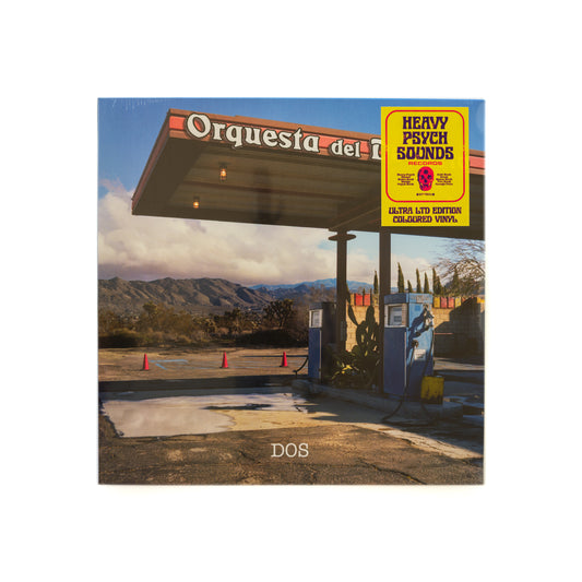 Front cover of Orquesta del Desierto – Dos vinyl LP, featuring a photograph southwestern desert gas station and a sticker from Heavy Psych Sounds that says Ultra Limited Edition Colored Vinyl. 