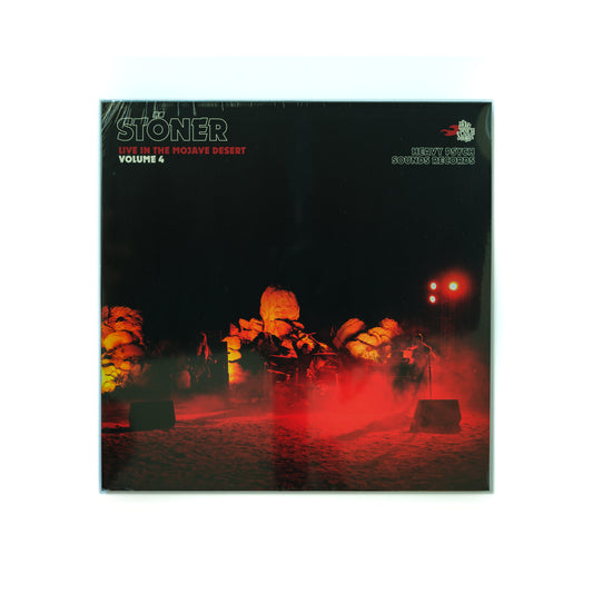 Front cover of Stöner – Live In The Mojave Desert Volume 4 vinyl LP, featuring a photo of the band playing in the desert at night surrounded by dust and the Stoner logo in bold. 