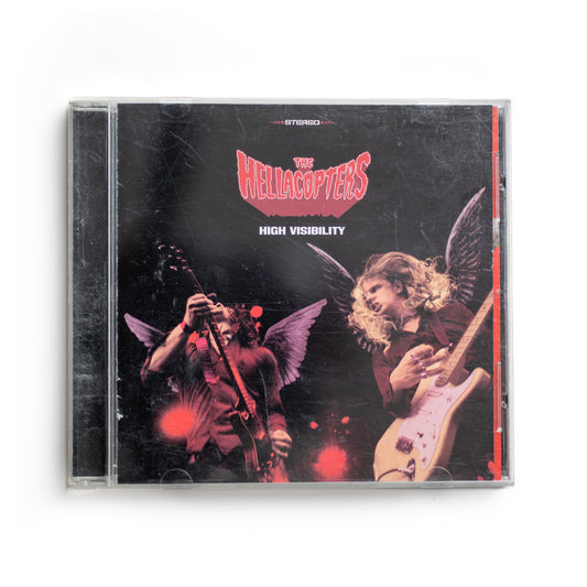 Front cover of The Hellacopters High Visibility CD featuring bold, vibrant artwork with a retro rock-n-roll style, 2000 album from Swedish garage rock band, includes tracks like 'By the Grace of God' and 'The Exorcist.