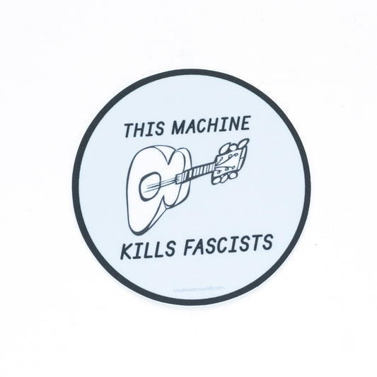 3-inch round vinyl sticker with “This Machine Kills Fascists” text — inspired by Woody Guthrie’s iconic guitar message — matte, waterproof, and UV coated. Features and illustration of a guitar. 

