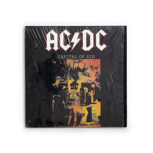 AC/DC Capital Of Sin vinyl LP front cover – blue translucent 2xLP, live 1979 Amsterdam concert, hard rock collectible, Bon Scott era, rare unofficial AC/DC release