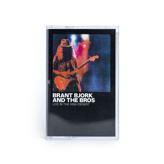 Cassette tape with 'Brant Bjork and The Bros' Live In The High Desert cover featuring a Brant playing guitar.