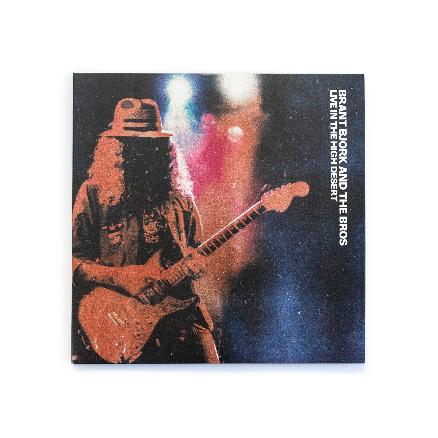 Album cover with a musician playing guitar, text 'Brant Bjork and The Bros Live in the High Desert' on a dark background.