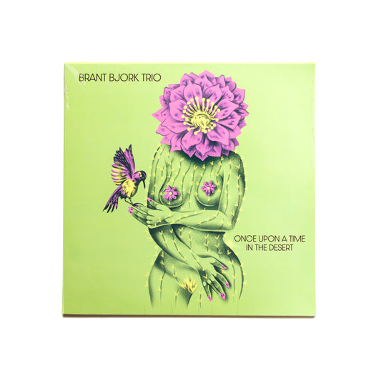 Album cover of Brant Bjork Trio – Once Upon a Time in the Desert red vinyl edition featuring an illustration of a person with a flower head and a butterfly.