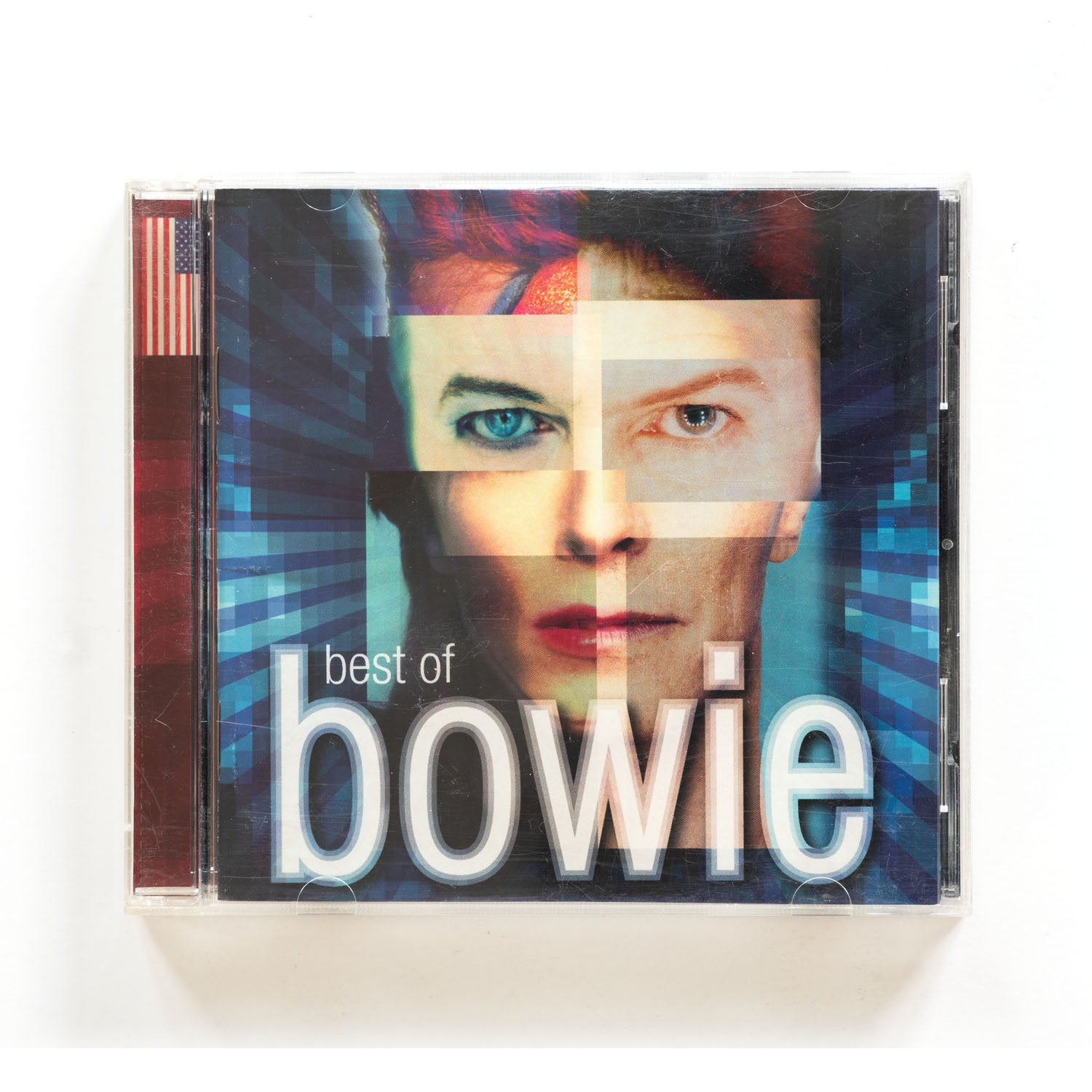 CD cover of 'Best of Bowie' with a face design and American flag on a white background