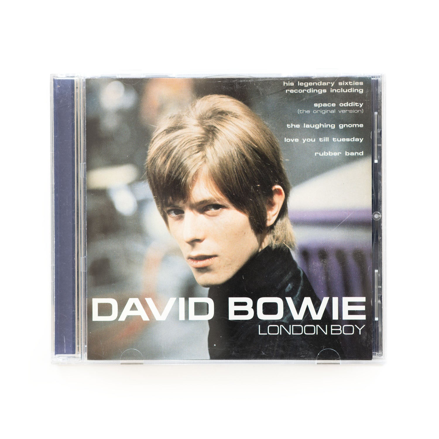 Cover of David Bowie London Boy CD featuring a photo of a young David Bowie. Text reads: his legendary sixties recordings including Space Oddity, The Laughing Gnome, Love You Till Tuesday,and Rubber Band. 