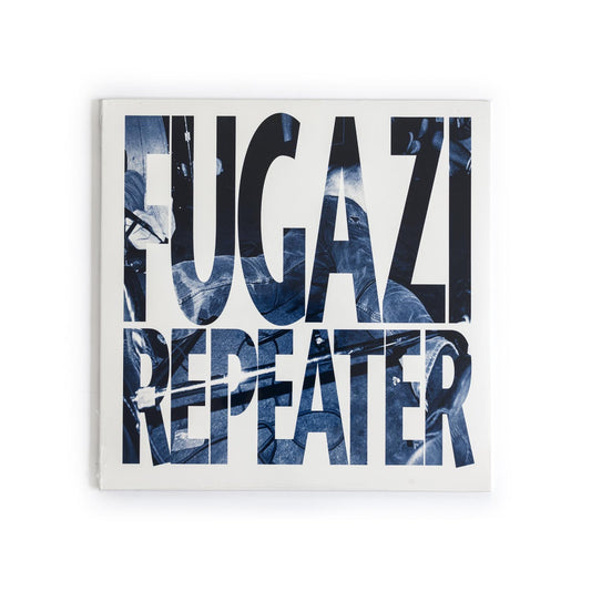 Fugazi – Repeater 2009 vinyl reissue album cover featuring blue abstract art with black background and band name in bold typeface.