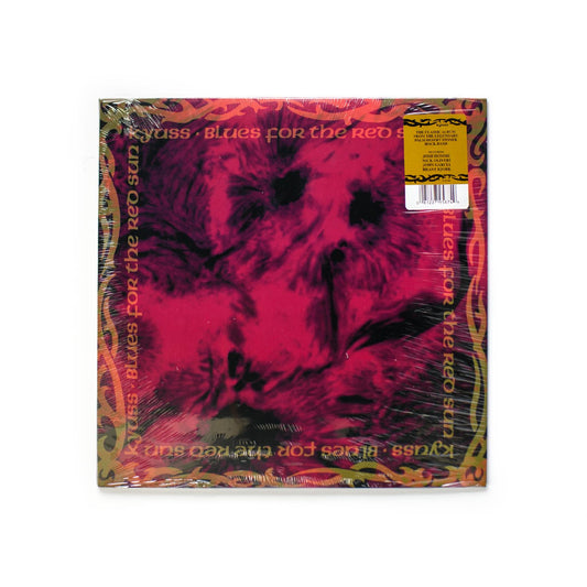 Kyuss Blues For The Red Sun front cover with red and black abstract solar imagery, bold stylized band logo at the top.