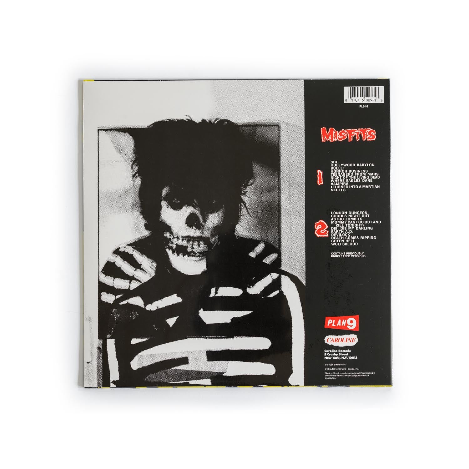 Back cover of Misfits – Misfits LP showing complete tracklist of 20 classic songs, label and pressing details, and Plan 9/Caroline Records branding; stark black-and-white punk aesthetic typical of early Misfits releases.