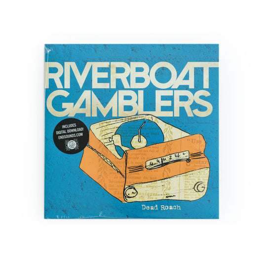 Front cover of Riverboat Gamblers – Dead Roach 7-inch vinyl EP featuring bold punk-style typography of the band name and a graphic illustration of a record cover. Eye-catching punk rock album artwork, representative of 2010s garage punk aesthetic.