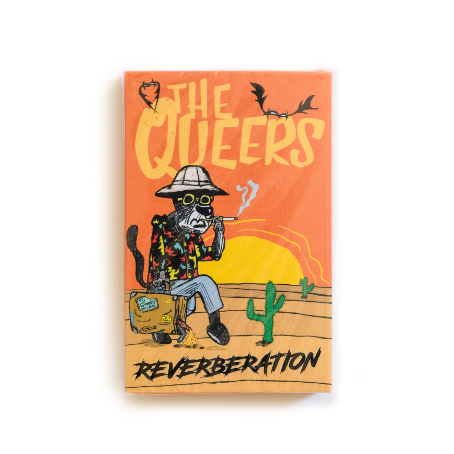 Cassette cover of 'The Queers: Reverberation' with a desert scene illustration.