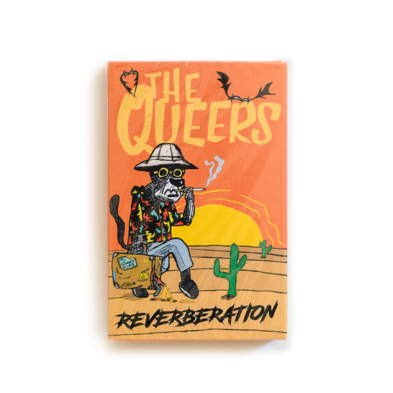 Cassette cover of 'The Queers: Reverberation' with a desert scene illustration.