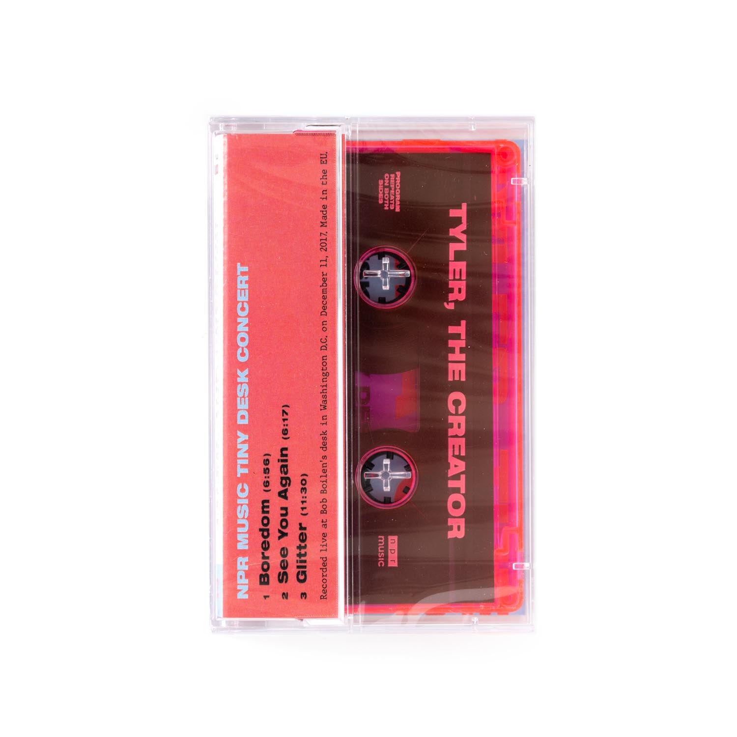 Cassette tape with red label featuring 'Tyler, The Creator' on a red background